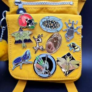 Luna Moth, Weevil, two flower Mantis, Rhino Beetle, Bumble Bee, Milkweed grasshopper, longhorn beetle, scarab and Lady Bug Hard Enamel Pins