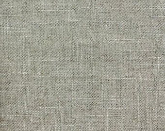 May include: Close-up of a beige linen fabric with a woven texture.