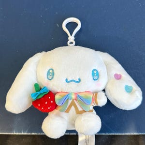 May include: A set of three ceramic mugs with a speckled, matte finish. The mugs are in shades of cream, light gray, and dark gray. Each mug has a simple, minimalist design, perfect for coffee or tea.