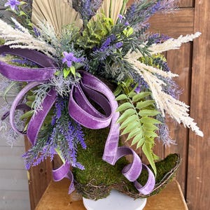 Boho southwestern cowgirl boot arrangement, Cowboy boot boho chic floral table decoration, Country western flower boot home wedding accent