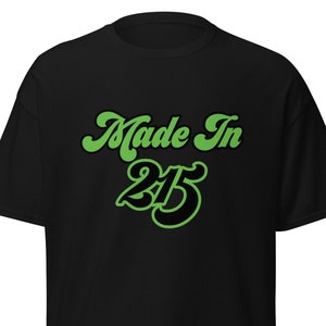 May include: Black t-shirt with green text that reads "Made In 215".