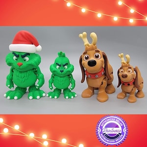 May include: Four Christmas-themed figurines. Two green figures resemble a character wearing a Santa hat. Two brown dog-like figures with antlers and red collars. The figures are on a gray surface with a red and white background.