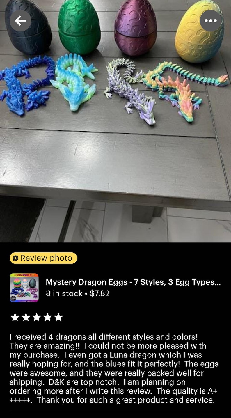May include: Four colorful plastic dragon figurines, each with a different design and color, are displayed on a table. The dragons are posed in a variety of positions, with their tails curled up and their wings spread out. The dragons are all about 6 inches long and are made of a soft, flexible plastic. The dragons are part of a set of mystery dragon eggs, which are also shown in the image. The eggs are made of a hard plastic and are about 3 inches in diameter. Each egg contains a different dragon figurine. The eggs are sold in a set of 7, with 3 different egg types. The product is called "Mystery Dragon Eggs - 7 Styles, 3 Egg Types..." and is available for purchase on Etsy.