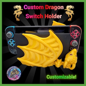 May include: A yellow 3D printed dragon switch holder for a Nintendo Switch console. The dragon is holding the console in its wings and has a red eye. The text "Custom Dragon Switch Holder" and "Customizable!" is visible in the image.
