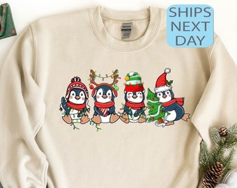 ペンギンのメリークリスマススウェットシャツ、かわいいペンギンのクリスマスライトセーター、クリスマスペンギン好きのためのパーカー、冬のホリデーセーター、クリスマスギフト