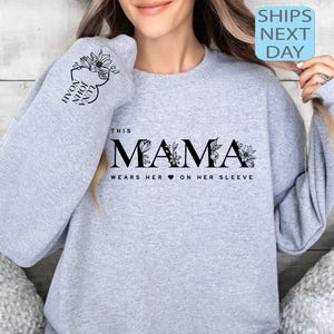 Custom This Mama Wears Her Heart On Her Sleeve Hoodie, Personalized Mom Sweatshirt With Kids Names, Cute Mama Hoodie, Mothers Day Gifts