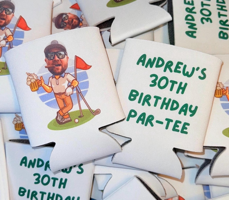 May include: White foam can coolers featuring a cartoon illustration of a man with a beard, sunglasses, and a cigar holding a beer mug on a golf course with a red flag. The text reads ANDREW'S 30TH BIRTHDAY PAR-TEE in green capital letters.
