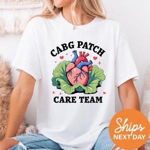 a woman wearing a t - shirt with a heart on it