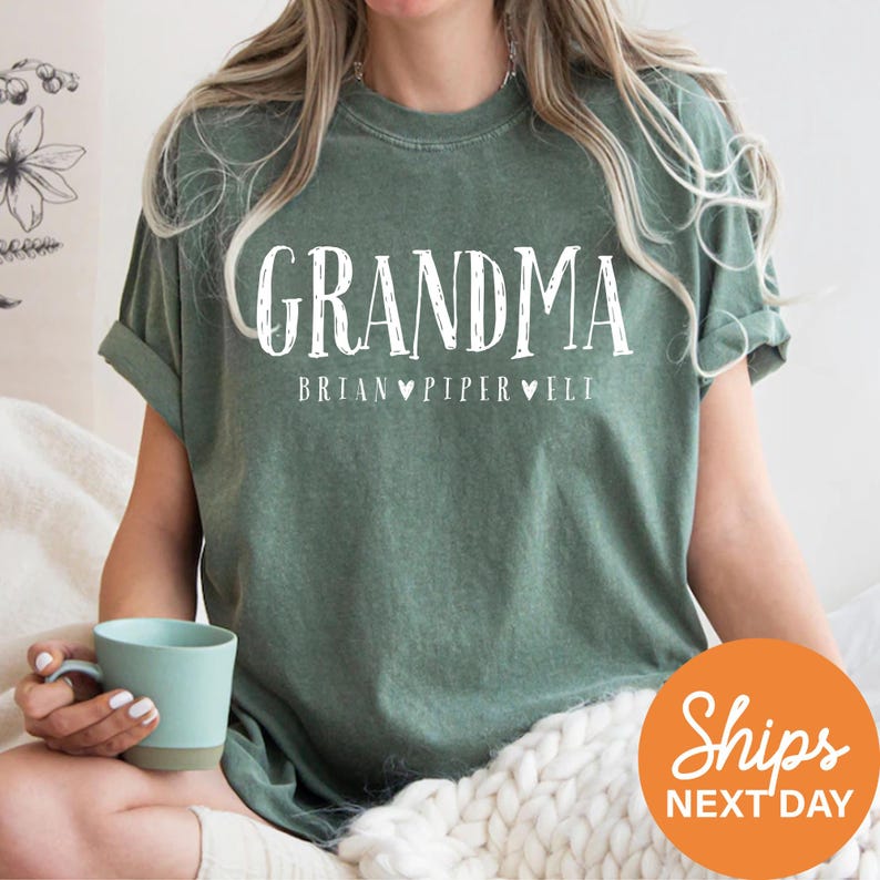 a woman sitting on a bed holding a cup of coffee