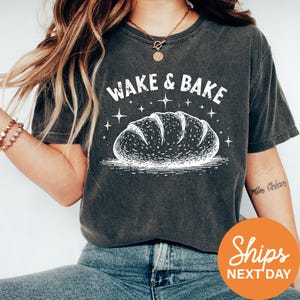 a woman wearing a wake and bake t - shirt