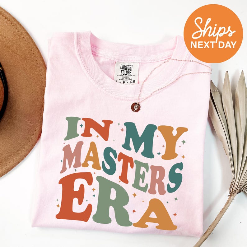 a pink shirt with the words in my masters era on it