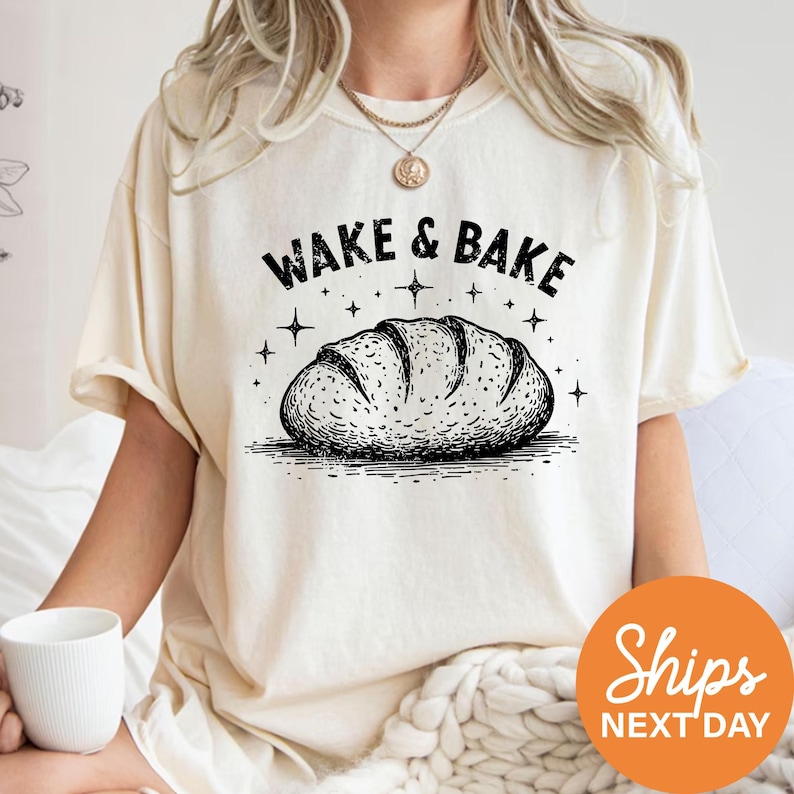 a woman wearing a wake and bake t - shirt while holding a coffee mug