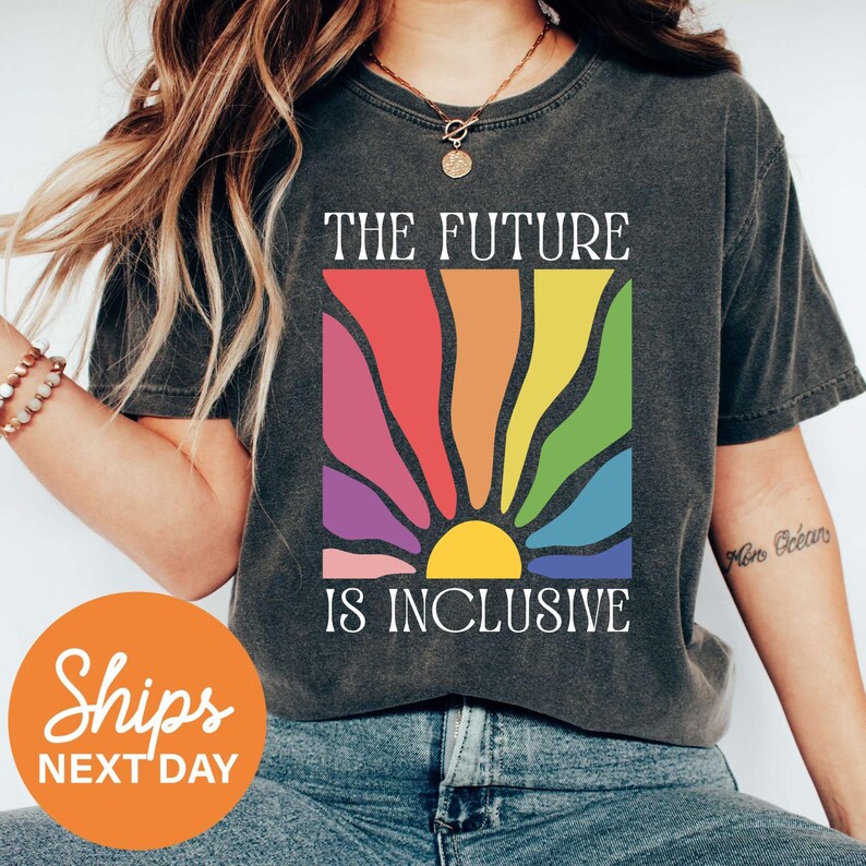 a woman wearing a t - shirt that says the future is inclusive