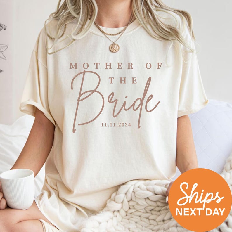 a woman wearing a t - shirt that says mother of the bride