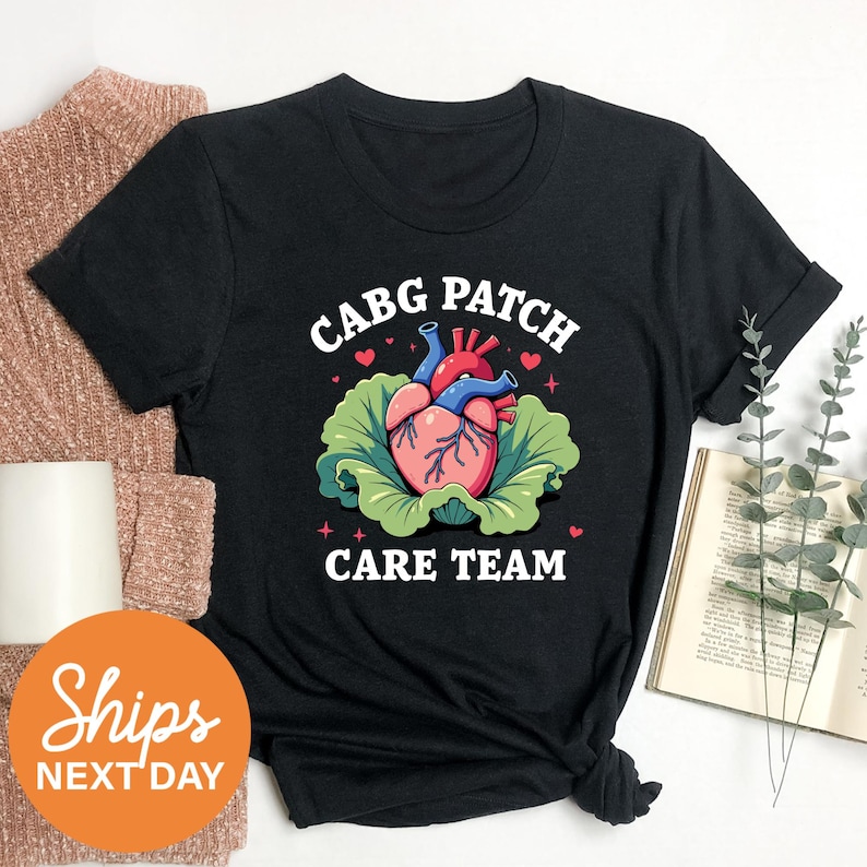 a black t - shirt with a picture of a heart on it