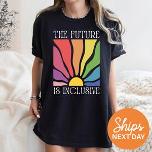 a woman wearing a t - shirt that says the future is inclusive