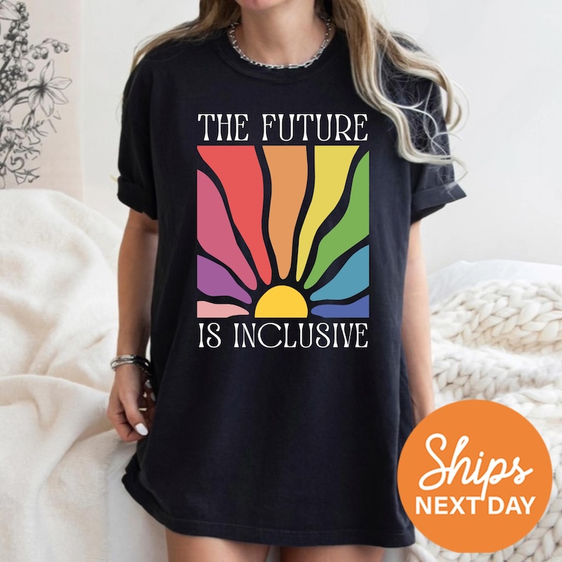 a woman wearing a t - shirt that says the future is inclusive