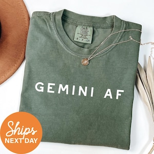 a t - shirt that says germin af next to a hat