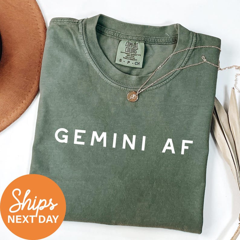 a t - shirt that says germin af next to a hat