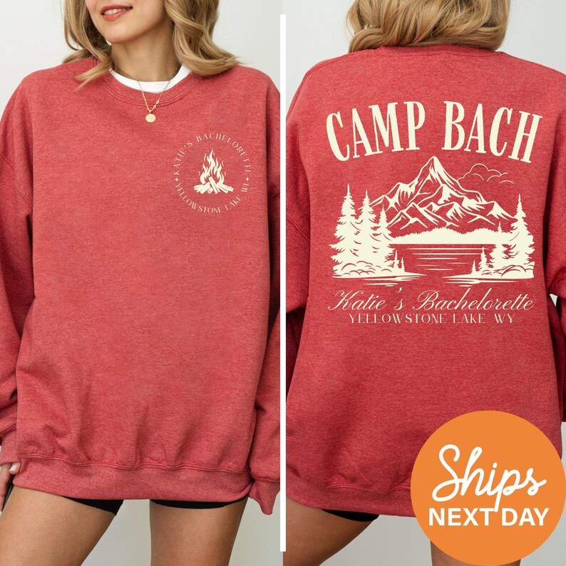 a woman wearing a red sweatshirt that says camp bach