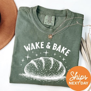 a green shirt with a picture of a loaf of bread on it