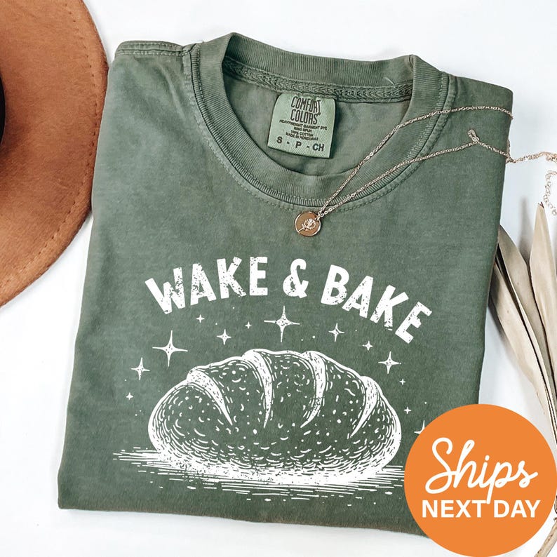 a green shirt with a picture of a loaf of bread on it