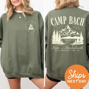 a woman wearing a sweatshirt that says camp bach