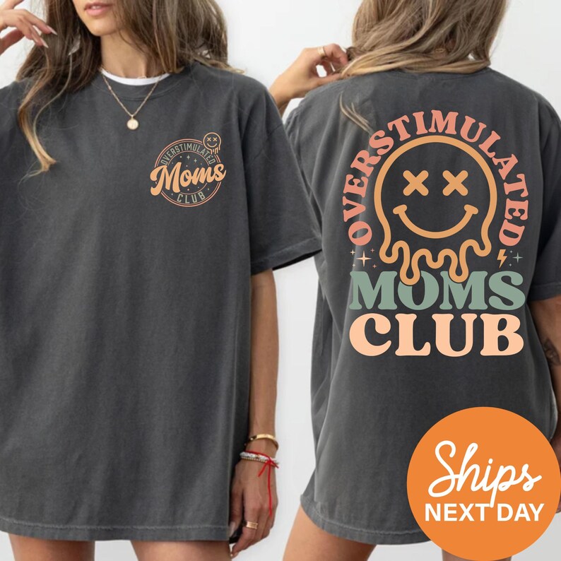 two gray t-shirts with text and graphics on the back.