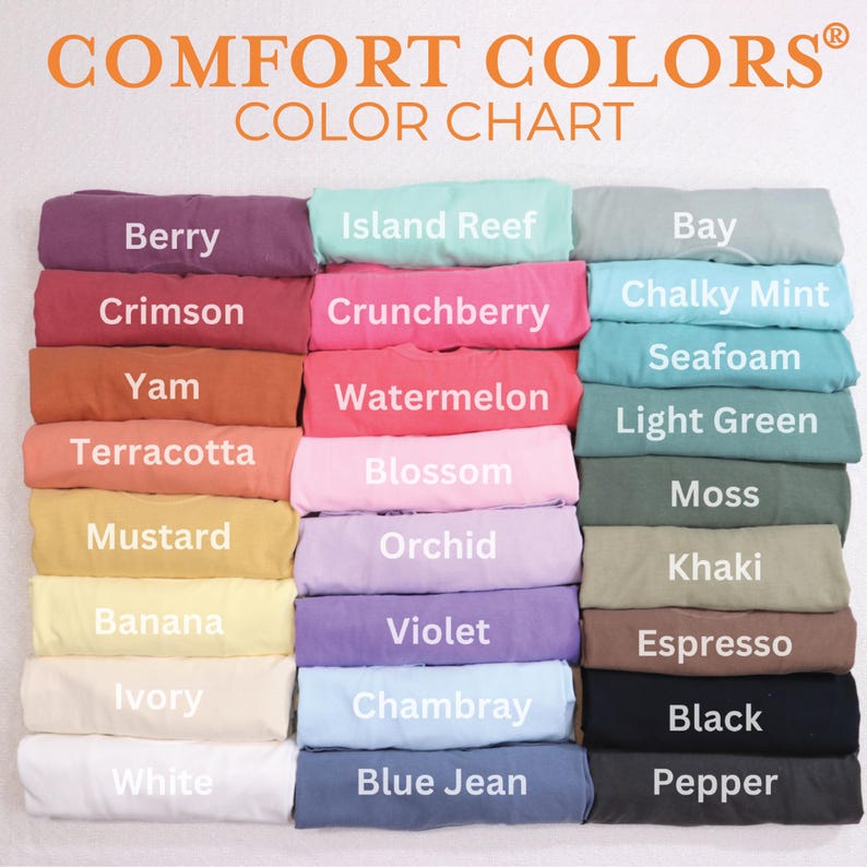 a color chart with various colored t-shirts arranged in rows, showcasing a range of colors from light to dark.