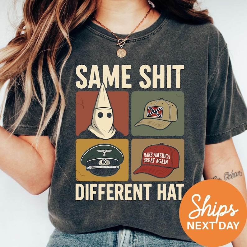 A person wearing a t-shirt with a graphic design featuring a skull, a hat, and a political message.