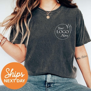 a woman wearing a t - shirt that says your logo here