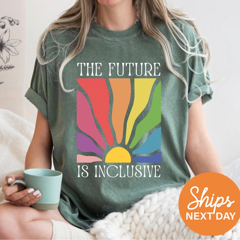 a woman sitting on a bed holding a cup of coffee