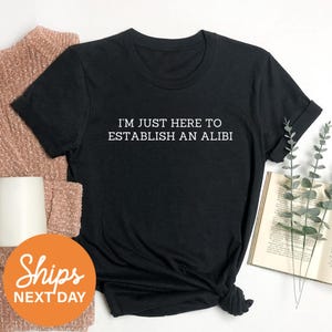 a t - shirt that says, i'm just here to established an ali
