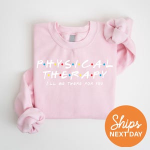 a pink shirt with the words physical therapy printed on it