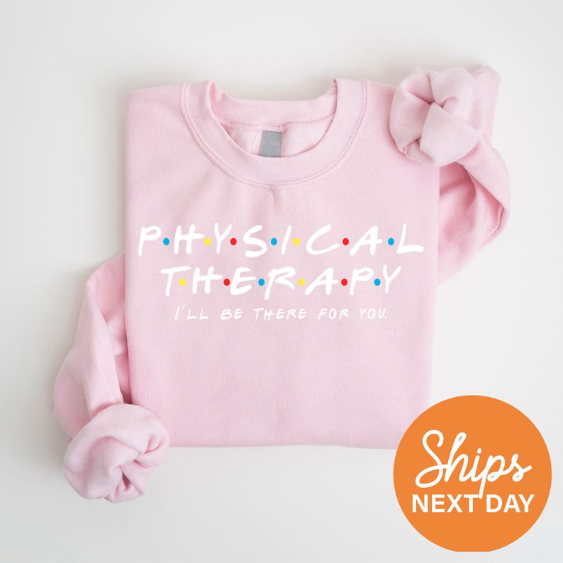 a pink shirt with the words physical therapy printed on it