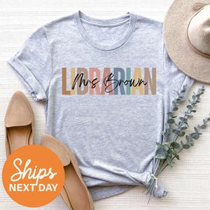 a t - shirt that says librarian next to a pair of shoes