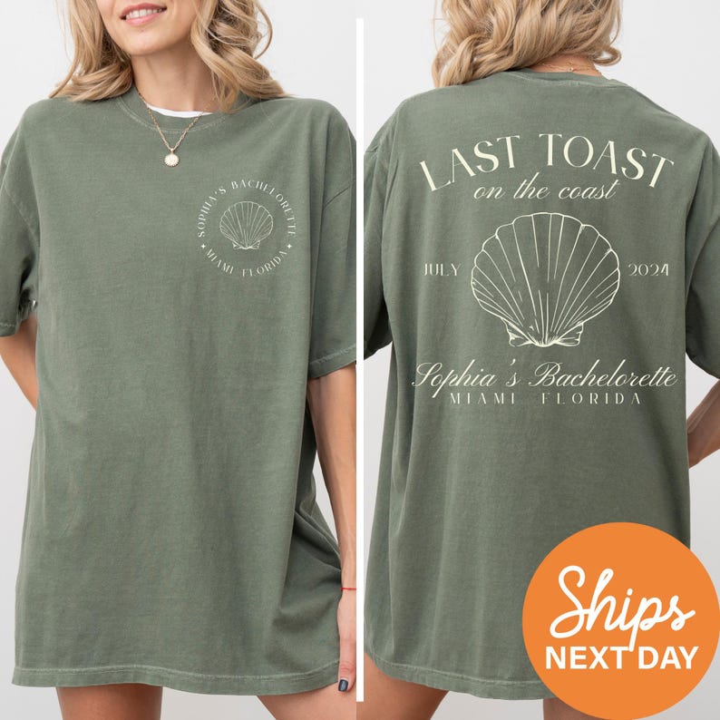 a woman wearing a green t - shirt with a seashell on it