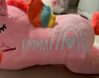big pink stuffed unicorn