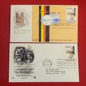 May include: Two envelopes commemorating the 50th anniversary of The Seeing Eye. One envelope features a German Shepherd illustration and the text "First Day Cover". The other envelope has a photo of Dorothy Harrison Eustis and a dog, with the text "Guide Dogs for the Blind".
