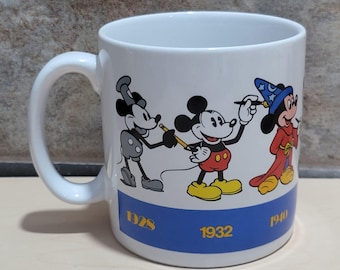 Taza de café vintage de Mickey Mouse: Aplausos, a través de los tiempos, 1928-1990