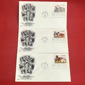 May include: Three envelopes with dog stamps and text. Each envelope has a collage of dog portraits and a stamp with a dog illustration. The text reads "Our Best Friends" and "American Kennel Club Centennial 1884-1984."