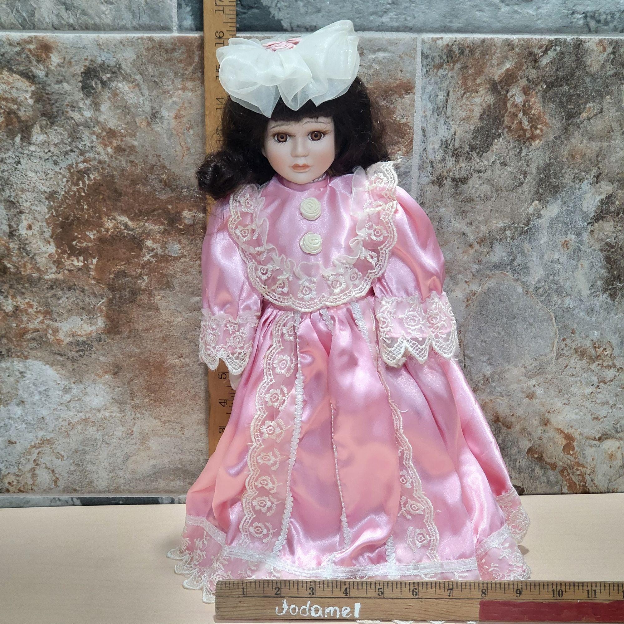 Vintage Porcelain Doll Dark Hair Pink Dress Lace Trim White Bonnet
