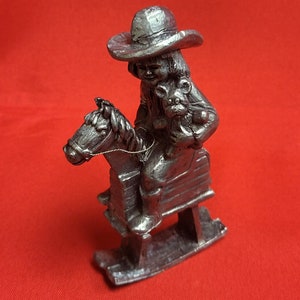Michael Ricker Pewter Figurine Cowgirl On Rocking Horse with Bear