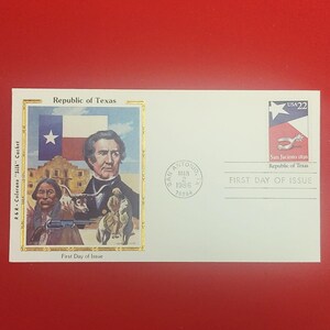 May include: A white first day of issue envelope featuring a Republic of Texas cachet with a portrait of a man, a Texas flag, a building, and a person on horseback. A 22-cent stamp shows a spur and the text San Jacinto 1836, Republic of Texas.