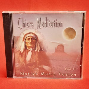 May include: CD case with the title "Chicra Meditation" and the subtitle "Native Music Fusion." The cover art features a Native American man in traditional headdress, a desert landscape, and a large moon.