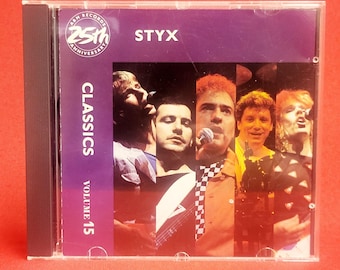 Op de afbeelding: Een cd-hoesje met de band Styx. De hoes is paars met de naam van de band en de tekst "Classics Volume 15". De cover art is een collage van de bandleden. De hoes zit in een doorzichtige plastic jewel case.