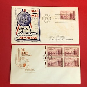 May include: Two vintage envelopes commemorating the 100th Anniversary of the Acquisition of New Mexico. One envelope features a U.S. seal and text, the other has a Native American design. Both have stamps and postmarks.