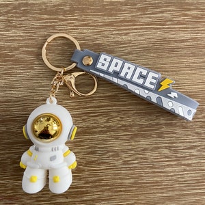  LOHONER Mysterious Space Quicksand Square Keychain Astronaut  Bag Charm Keyring Jewelry : Clothing, Shoes & Jewelry