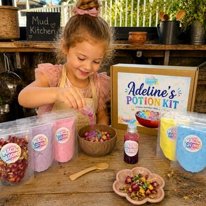 May include: A potion kit set featuring a cardboard box labelled Adeline's Potion Kit, several clear pouches of coloured powders and dried flowers labelled Magic Fizz Dust and Magic Blooms, a bottle of Sparkle Syrup, a wooden spoon, and a flower-shaped bowl.