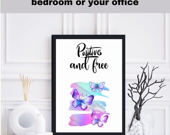 May include: Black framed wall art with a white background and a rainbow watercolor design. The design features three butterflies and the text "Positive and free".